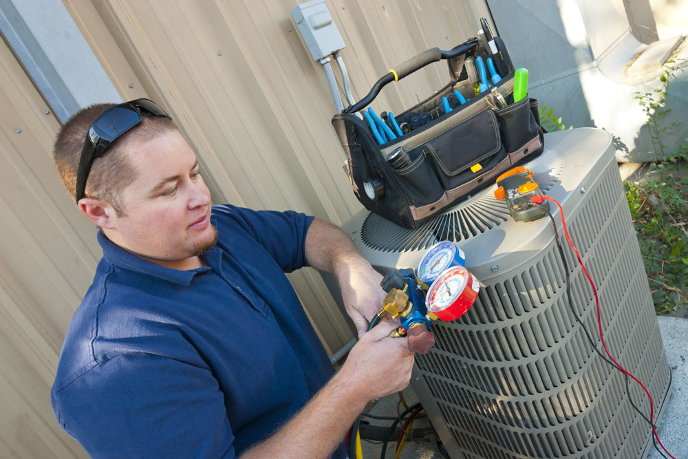 HVAC Technician Checking and Fixing AC