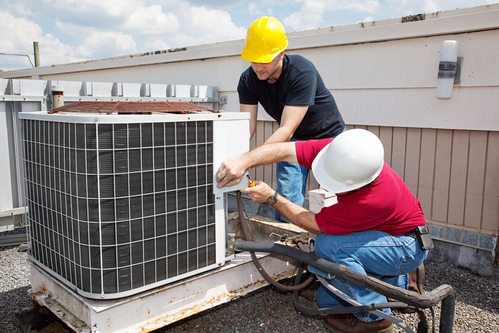 Two Technicians Fixing HVAC - Reliable AC Solutions