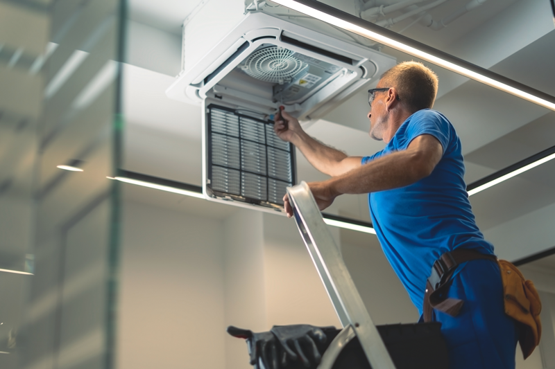 Reliable AC Solutions HVAC Technician Repairing Commercial AC Houston